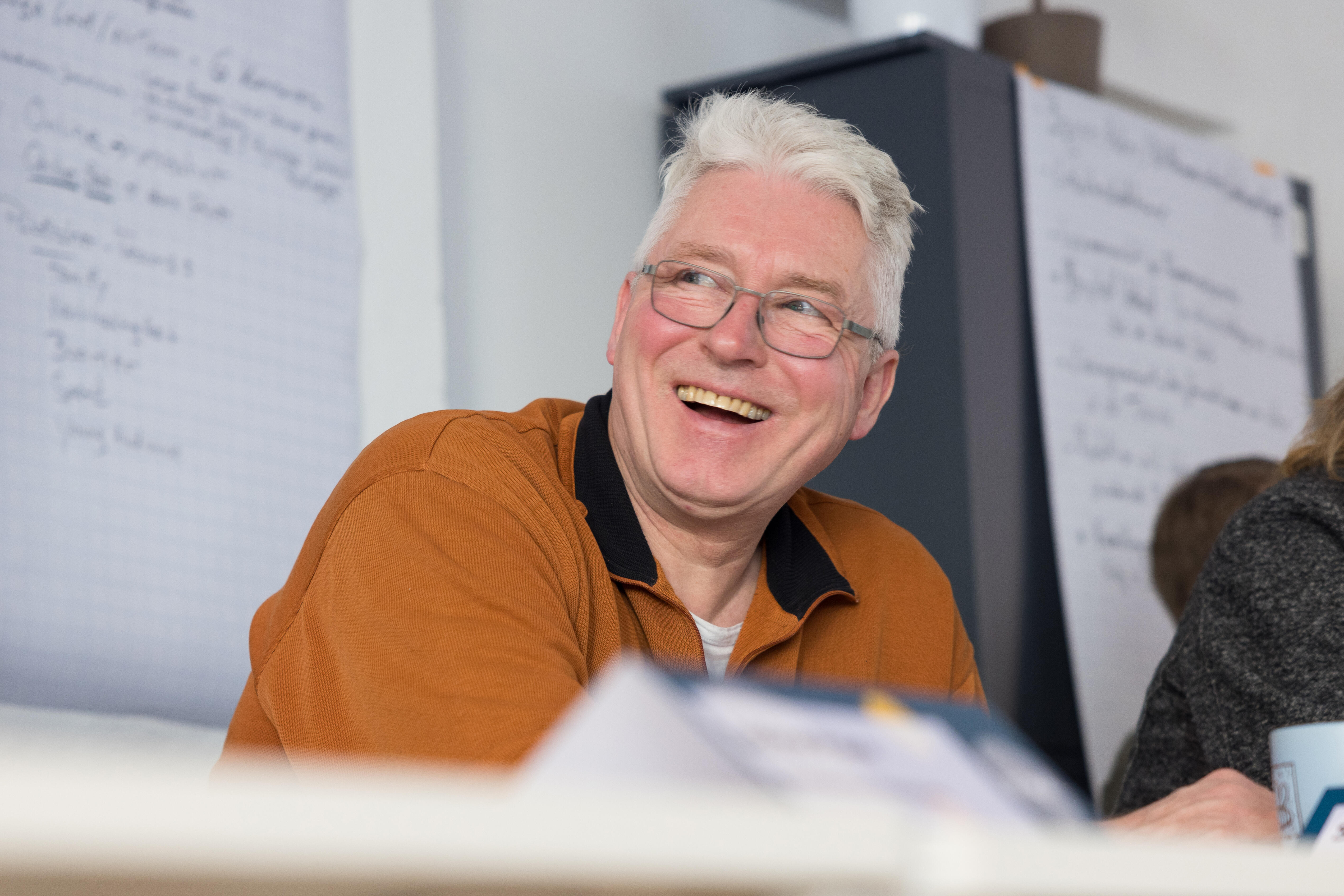 A man taking part in b° local smiles during the kickoff workshop