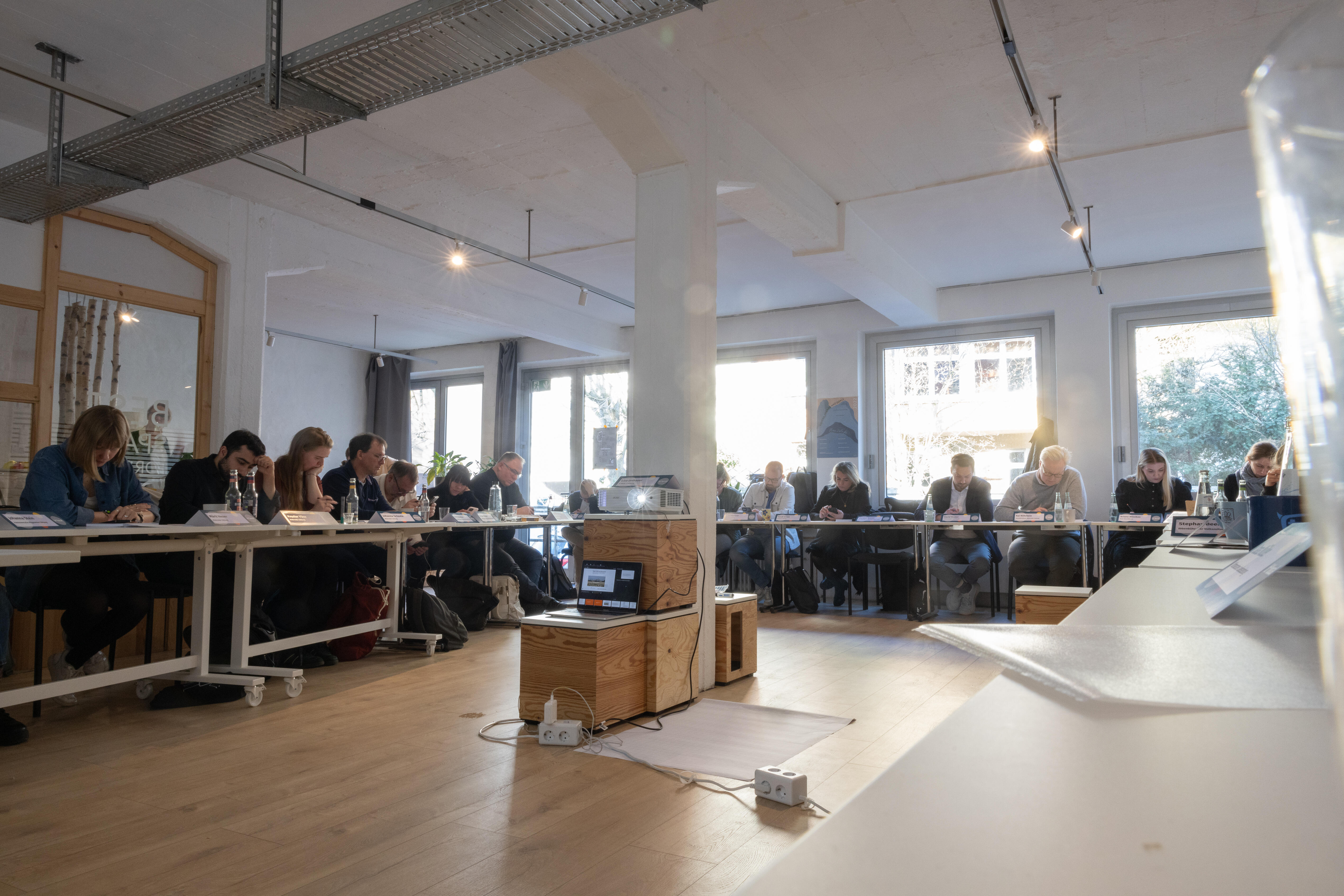 b° local participants at their desks in the seminar room